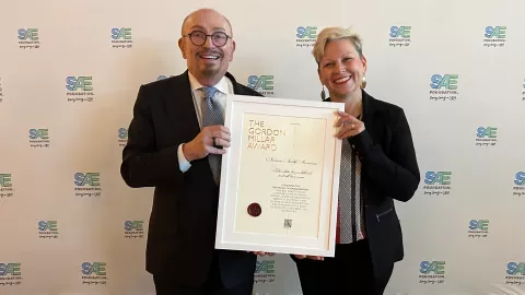 Don Manvel and Ali Tonn hold Gordon Millar Award